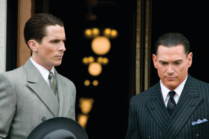 Special Agent Melvin Purvis (Christian Bale) and  J. Edgar Hoover (Billy Crudup)